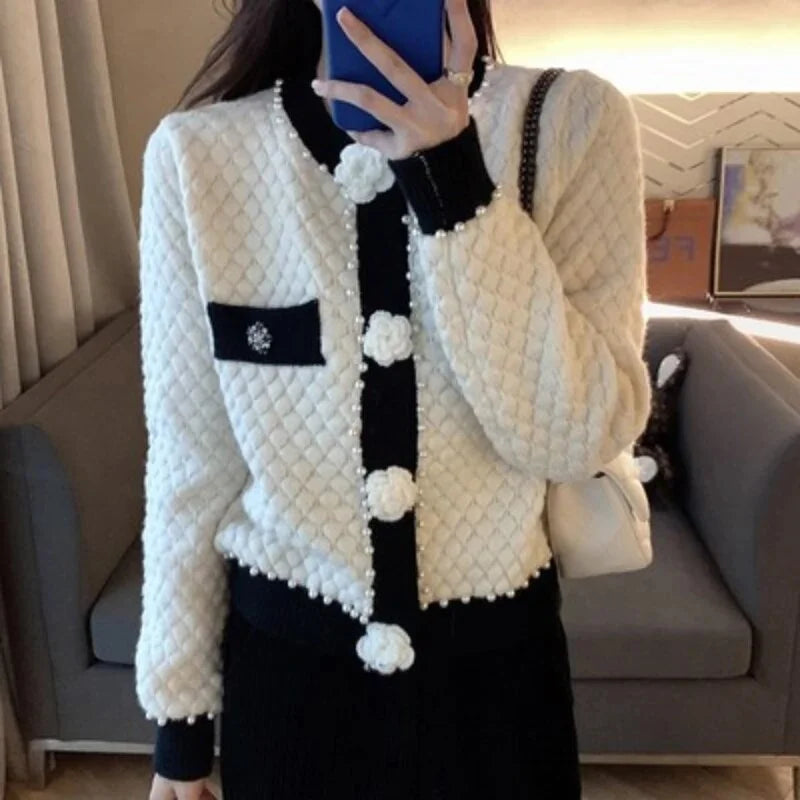 Women's cardigan with pearl embellishments and decorative pockets