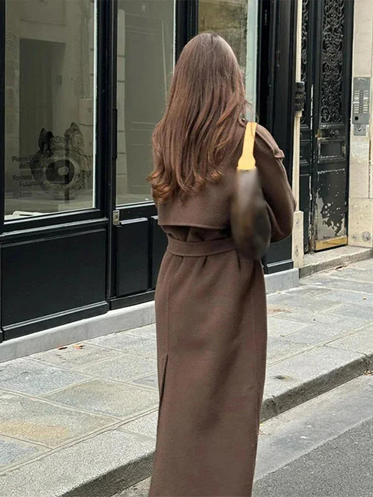 Mid-length women's coat with belt and buttons