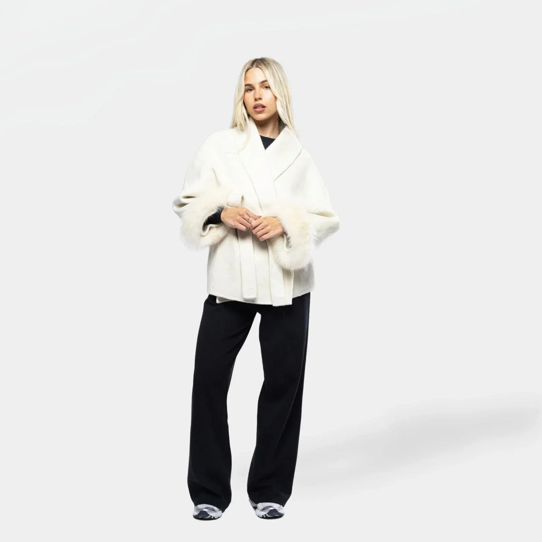 White belted women's jacket with synthetic fur sleeves