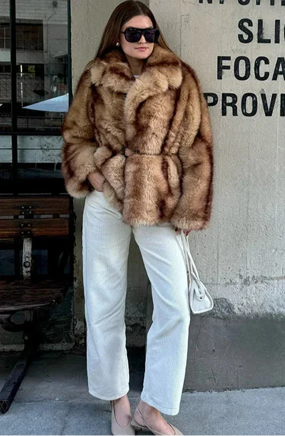 Elegant brown jacket for women with a striking closure