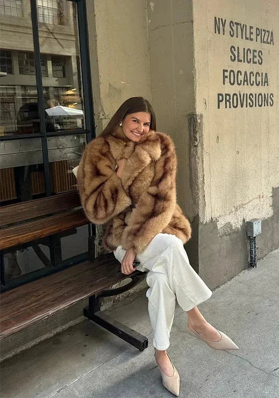Elegant brown jacket for women with a striking closure
